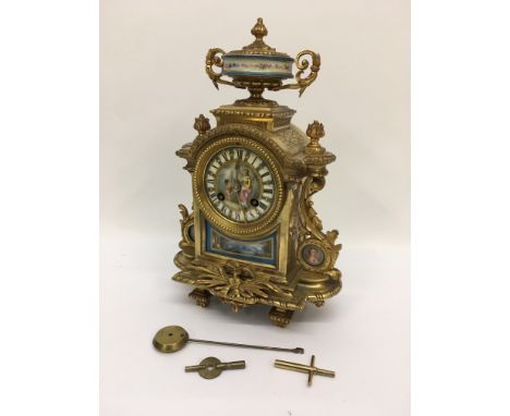An eight day French gilt metal mantle clock with painted enamel dial, approx 31.5cm.