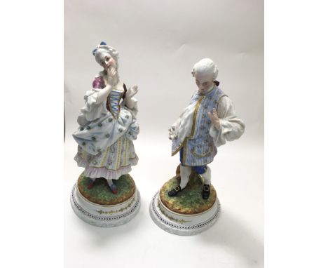 A finely decorated pair of Victorian German bisque porcelain figures.Each approx 34cm.One with incised initials 'JS' to base 