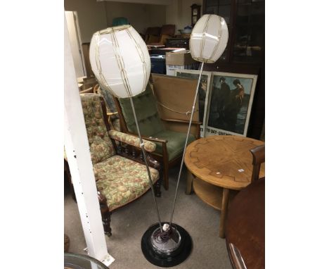 A modern design chrome standard lamp fitted with twin lamps.