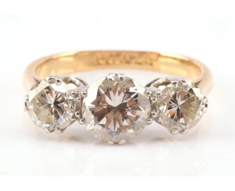 Three stone diamond ring, with round brilliant cut diamonds estimated total weight 2.18 carats, mounted in 18 ct and platinum
