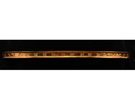 Oval bangle with floral detail, measures 70mm in diameter, stamped 18 ct yellow gold. Condition Report:  18 ct 12.6 grams 