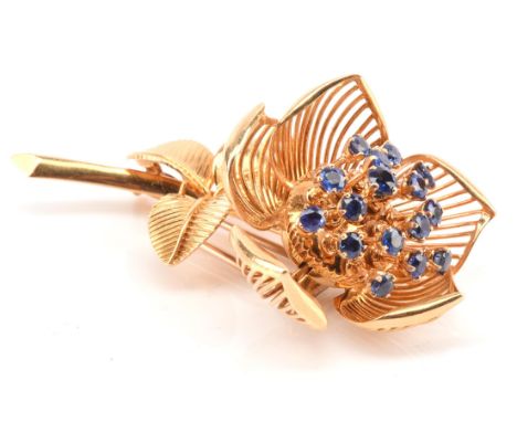 Vintage Asprey Sapphire 'En Tremblant' floral brooch, with sixteen round cut sapphires enclosed within five articulated petal