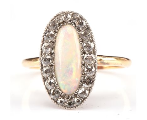 Opal cabochon and old cut diamond ring, central opal estimated weight 0.40 carat, in an oval millgrain setting, estimated tot