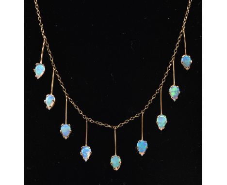 Opal fringe necklace, set with nine pear shaped opals measuring 40cm long with a spring clip clasp and a similar pair of opal