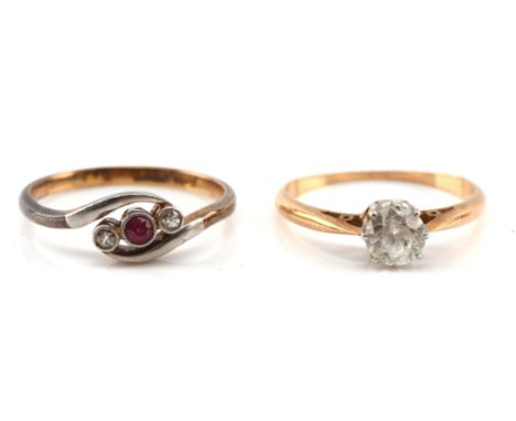 Two rings, one Edwardian set ruby and diamond ring, mounted in a twist design, stamped platinum, and 18 ct, ring size K and a