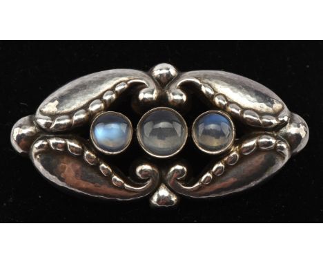 Georg Jensen brooch, centrally set with three round cabochon cut moonstones, pin and roll catch fitting, reverse numbered 156