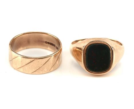 1970's signet ring set with a bloodstone plaque, ring size U, hallmarked 1978 and a wedding band 8mm in thickness with twist 