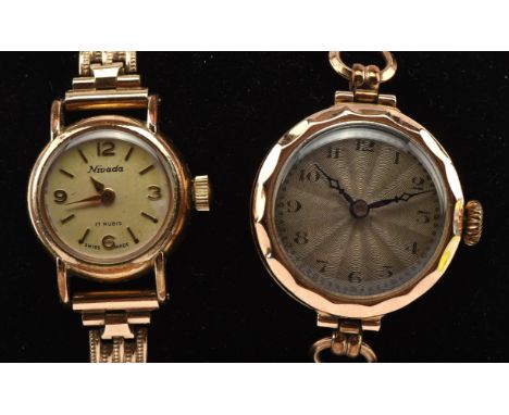 Gold watch in 9 ct with circular face and engine turned dial, with Arabic numerals, with a manual wind movement,  mounted on 