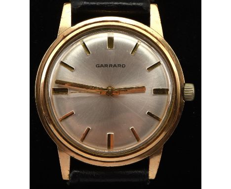 Garrards  A Gentleman's gold wristwatch, the signed silvered dial with baton hour markers and centre seconds, fitted with a m