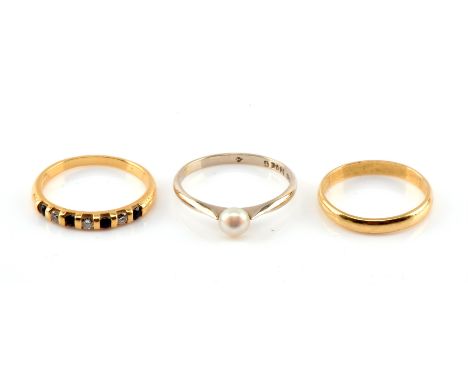 Three 18 ct gold rings, including a round cut sapphire and diamond tension set, ring size L, a single stone pearl ring with t