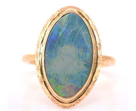 Marquise cut opal ring, opal measures 18mmx10mm mounted within an engraved shank, stamped 9 ct, size OCondition Report:  9 ct