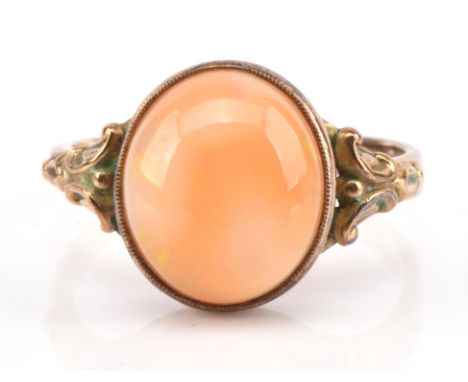 Opal cabochon ring, set within 8 ct yellow gold scroll shoulders, ring size MCondition Report:  gross weight 2.7 grams 
