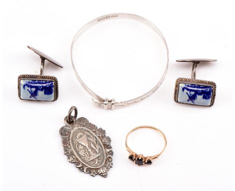 Sapphire three stone ring in 9 ct Size G dated 1983, together with a pair of enamel cufflinks, a baby's bangle and pendant, a