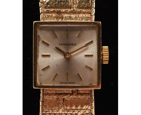 Longines A Ladies gold wristwatch, the signed silvered dial with baton hour markers, fitted with a calibre 410 manual wind mo