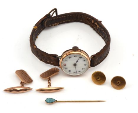 A mixed group of gold items, including a pair of engine turned cufflinks, wristwatch with white enamel dial with Arabic numer