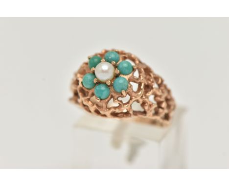 A BRUTALIST STYLE CLUSTER RING, a 9ct gold open work textured ring, set with a single 3.5mm pearl, with surround of six turqu
