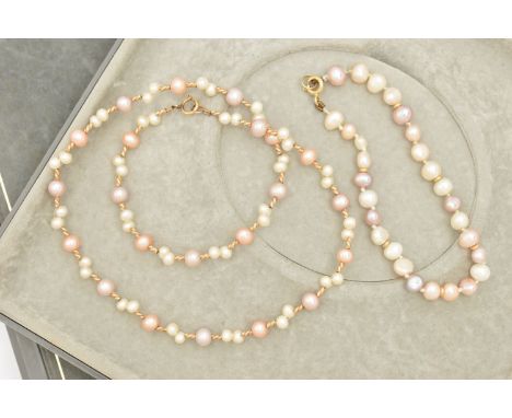 A CUTLURED PEARL NECKLACE AND BRACELET, baroque pearl necklace with yellow metal spacers, fitted with a spring clasp, stamped
