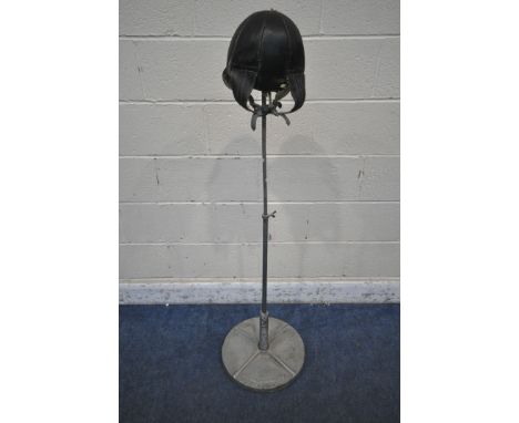 FRANK BRYAN LTD OF WORCESTER, AN EARLY 20TH CENTURY PUNCH BAG, with leather inflatable bag, with sprung upright, on a heavy m