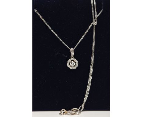 A 9CT WHITE GOLD DIAMOND PENDANT AND WHITE METAL CHAIN, a circular cluster pendant, set with a central round brilliant cut di