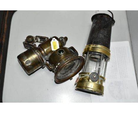 A JOSEPH LUCAS CALCIA CLUB CARBIDE MOTORCYCLE OR BICYCLE LAMP, with a Patterson &amp; Co. type AD Miners Safety lamp, both ap