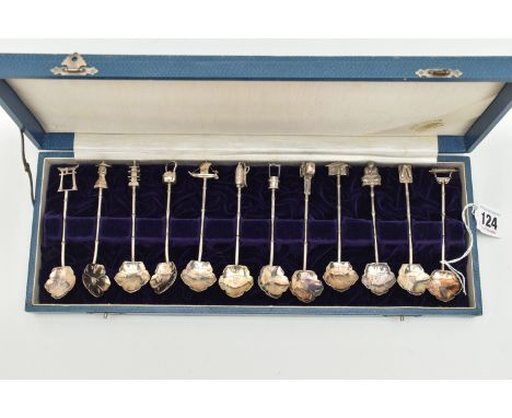 A CASED SET OF CONTINETAL WHITE METAL TEASPOONS, a set of twelve teaspoons, with flower shape bowls, each with a different it