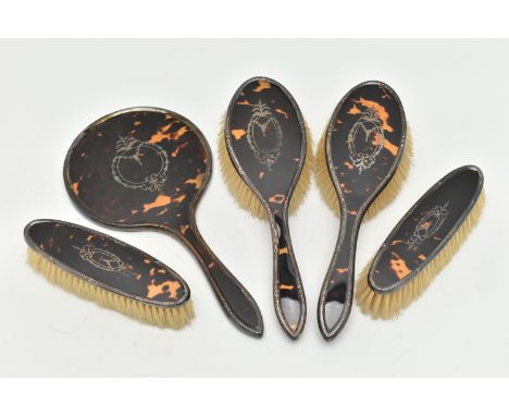 A BOXED SILVER AND FAUX TORTOISESHELL DRESSING TABLE SET, comprising of two hair brushes, two clothes brushes, and a hand hel