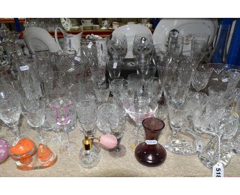 A QUANTITY OF CUT CRYSTAL AND OTHER GLASS WARE, to include assorted drinking glasses, vases, bowls and decanters, including t