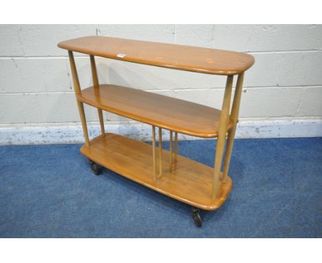 LUCIAN ERCOLANI, ERCOL, A MID CENTURY ELM AND BEECH 'BABY GIRAFFE' THREE TIER TROLLEY BOOKCASE, model 361 width 92cm x depth 