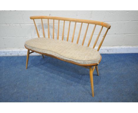 LUCIAN ERCOLANI, ERCOL, A MID CENTURY ELM AND BEECH DINING LOVE SEAT, with bentwood and spindle back rest, raised on cylindri