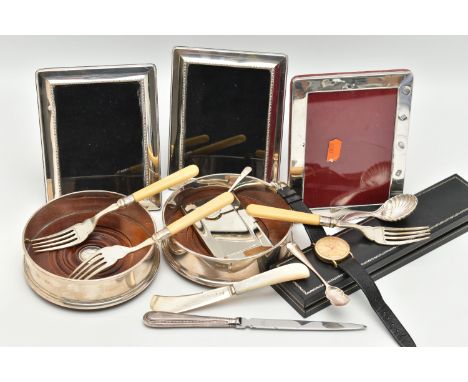 A SELECTION OF SILVER ITEMS, to include two silver and wooden based bottle coasters, each hallmarked 'John Bull Ltd' London 2