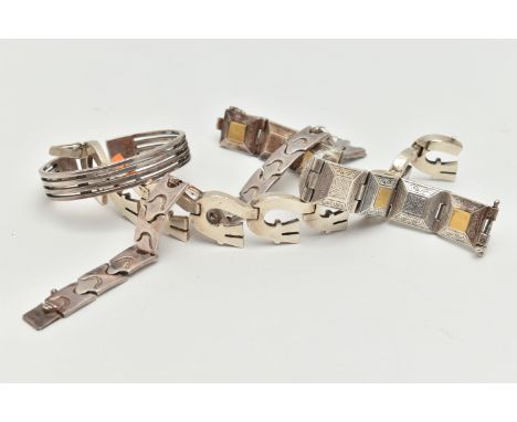 FOUR WHITE METAL BRACELETS, the first a heavy Grecian white metal bracelet comprised of nine square panels, yellow metal deta