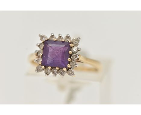 A 9CT GOLD AMETHYST AND DIAMOND CLUSTER RING, set with a central square cut amethyst, in a surround of small round brilliant 