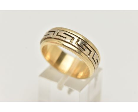 A BI COLOUR GREEK RING, a yellow metal ring, fitted with a central spinning Greek key pattern, approximate band width 8mm, st