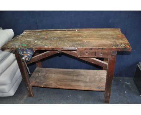 A VINTAGE WOODEN WORKSHOP BENCH with a single drawer and vice fitted width 137cm depth 60cm height 85cm