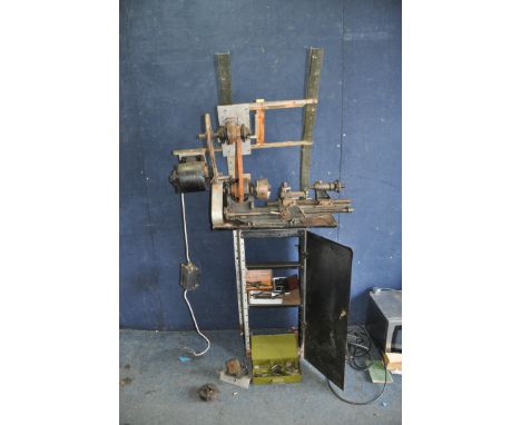 A VINTAGE MYFORD A5 LATHE on a bespoke stand with an 18in bed length, an end mill attachment, a four independant jaw chuck, d