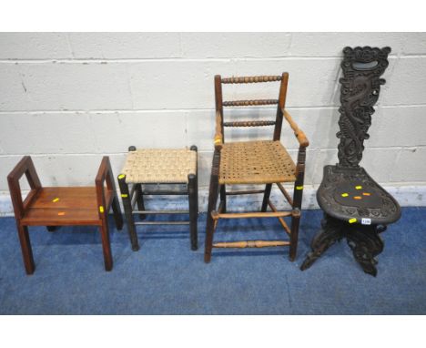 AN ORIENTAL CARVED CHAIR, with dragon and other carved details, a child's rush seated high chair, a rush seated stool, along 