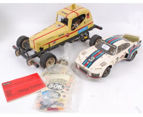 RC CARS; Two vintage handmade RC cars - one with a glow plug engine fitted, the other electric. Comes with a small quantity o