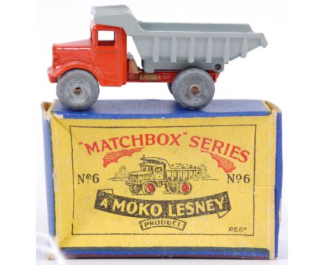 MOKO LESNEY; An original vintage Moko Lesney diecast model No. 6 Quarry Truck. Orange body, with grey tipper, and original me