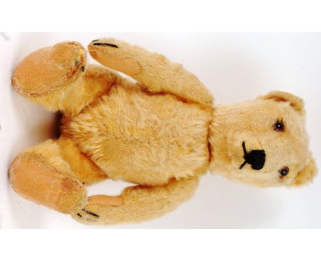 A 1950's BLONDE MOHAIR STEIFF TEDDY BEAR; An original c1952 9" blonde mohair Steiff teddy bear. With original button to ear, 