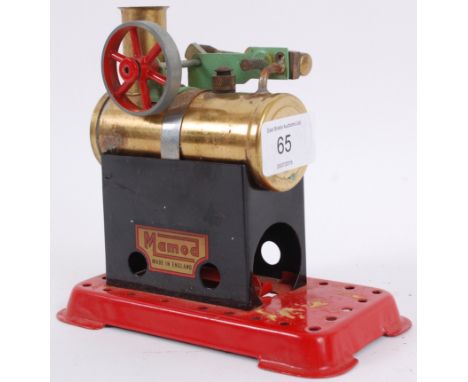 LIVE STEAM; an original vintage small Mamod Live Steam power plant, consisting of brass boiler and flywheel, on a red painted