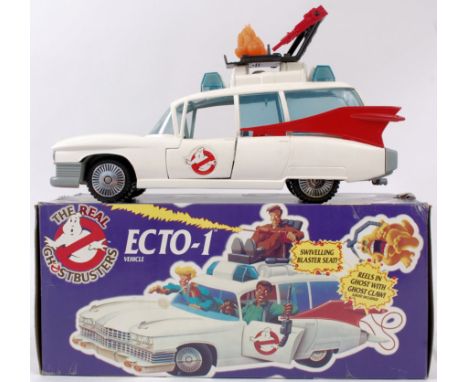 THE REAL GHOSTBUSTERS; An original The Real Ghostbusters Ecto 1 by Kenner. The car complete with claw mechanism, orange ghost