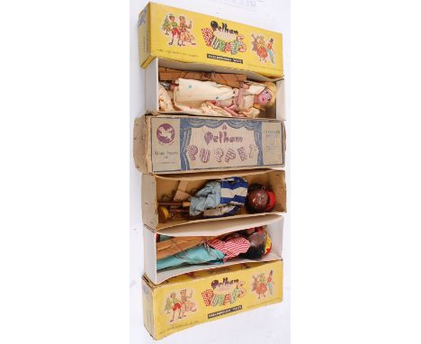 PELHAM PUPPETS; A collection of 3x vintage Pelham Puppets - one early brown boxed puppet ' Nigger Boy ', and 2x others in yel