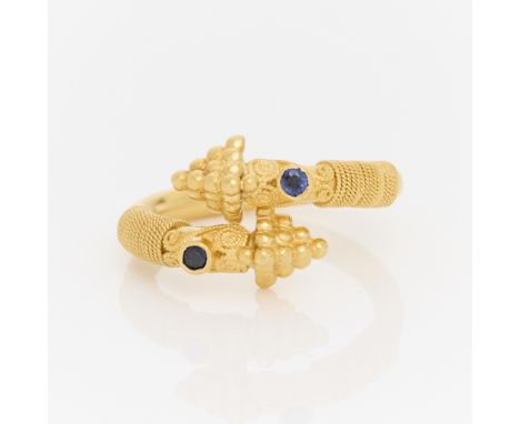 22k yellow gold bypass style ring bezel set with two small round sapphires of approximately .40 ctw. With finely applied gran
