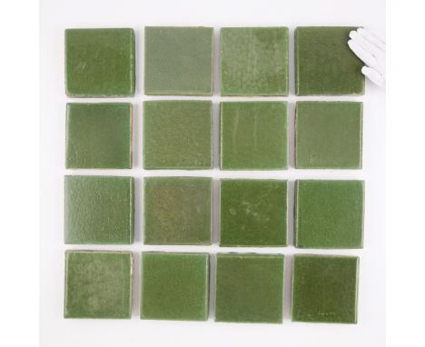 Grueby Faience Company, Boston, Massachusetts. Group of 16 American Arts and Crafts enameled green ceramic pottery tiles, lat