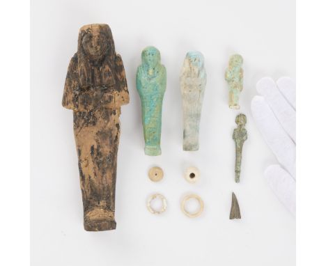 Group of ten ancient Egyptian antiquities and artifacts. Includes several ushbati of faience ceramic pottery or wood, Old Kin