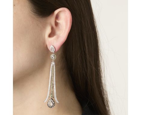 Sethi Couture 18k white gold chandelier earrings. Comprised of four sections. At the top, a pear shaped rose cut diamond surr