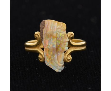 14k yellow gold ring set with a Wilhelm Schmidt carved opal matrix cameo depicting a vestal virgin. The ring formed of a doub