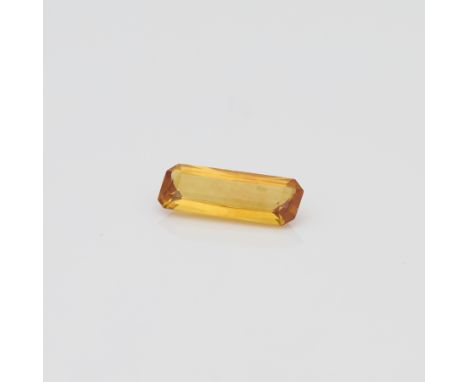One 1.00 carat step cut elongated yellow sapphire.Length: 9.94 mm x width: 3.84 mm x depth: 2.30 mm. Gross weight: 1 ct.Condi