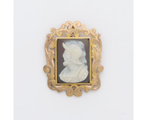 10k yellow gold brooch set with hardstone cameo depicting Mars/Aries in a swirly vegetal frame, with locking c clasp closure 