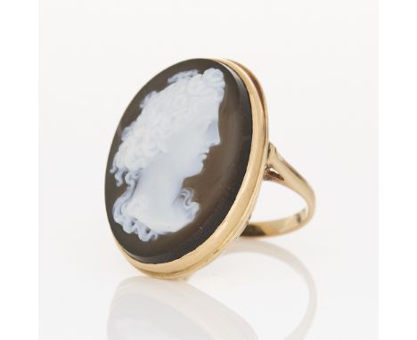 14k yellow gold ring set with a large oval sardonyx panel depicting the goddess Flora/Persephone in profile, finely craved. M